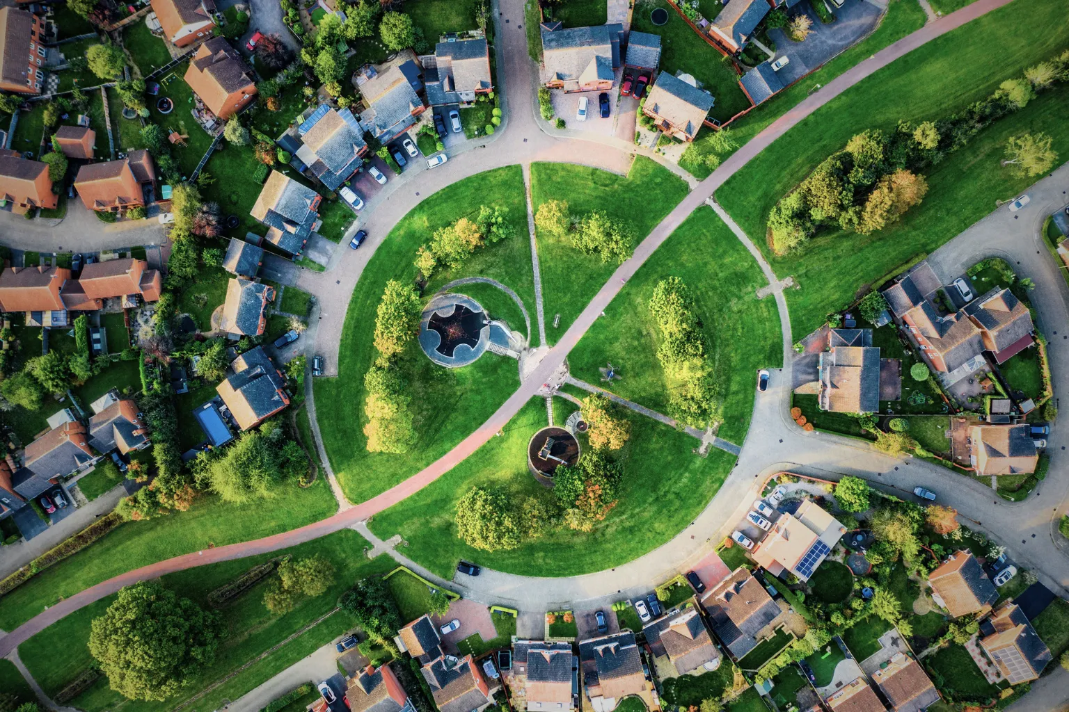 Aerial view of a circular residential housing development with central green space