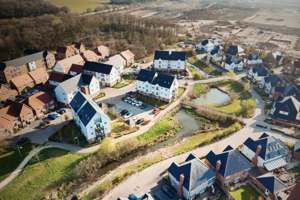 Aerial view of a modern residential housing development with green spaces